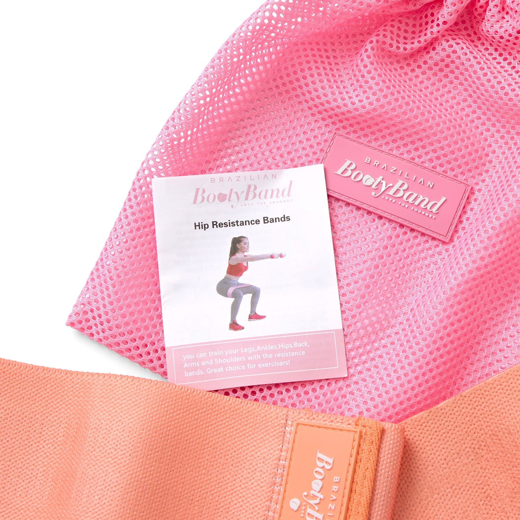 Pink resistance band with a label and instruction sheet 