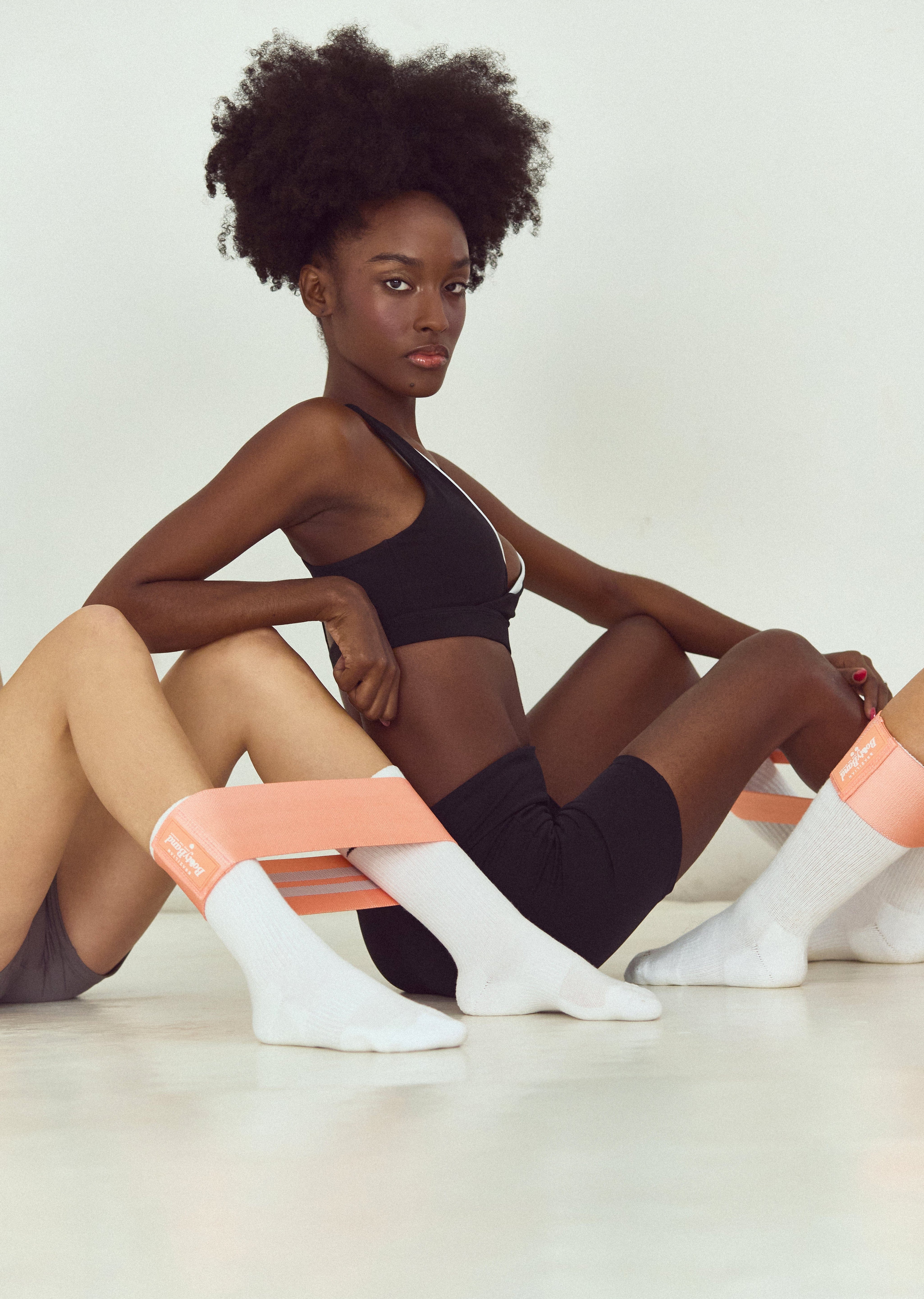 Woman exercising with resistance band, fitness accessories