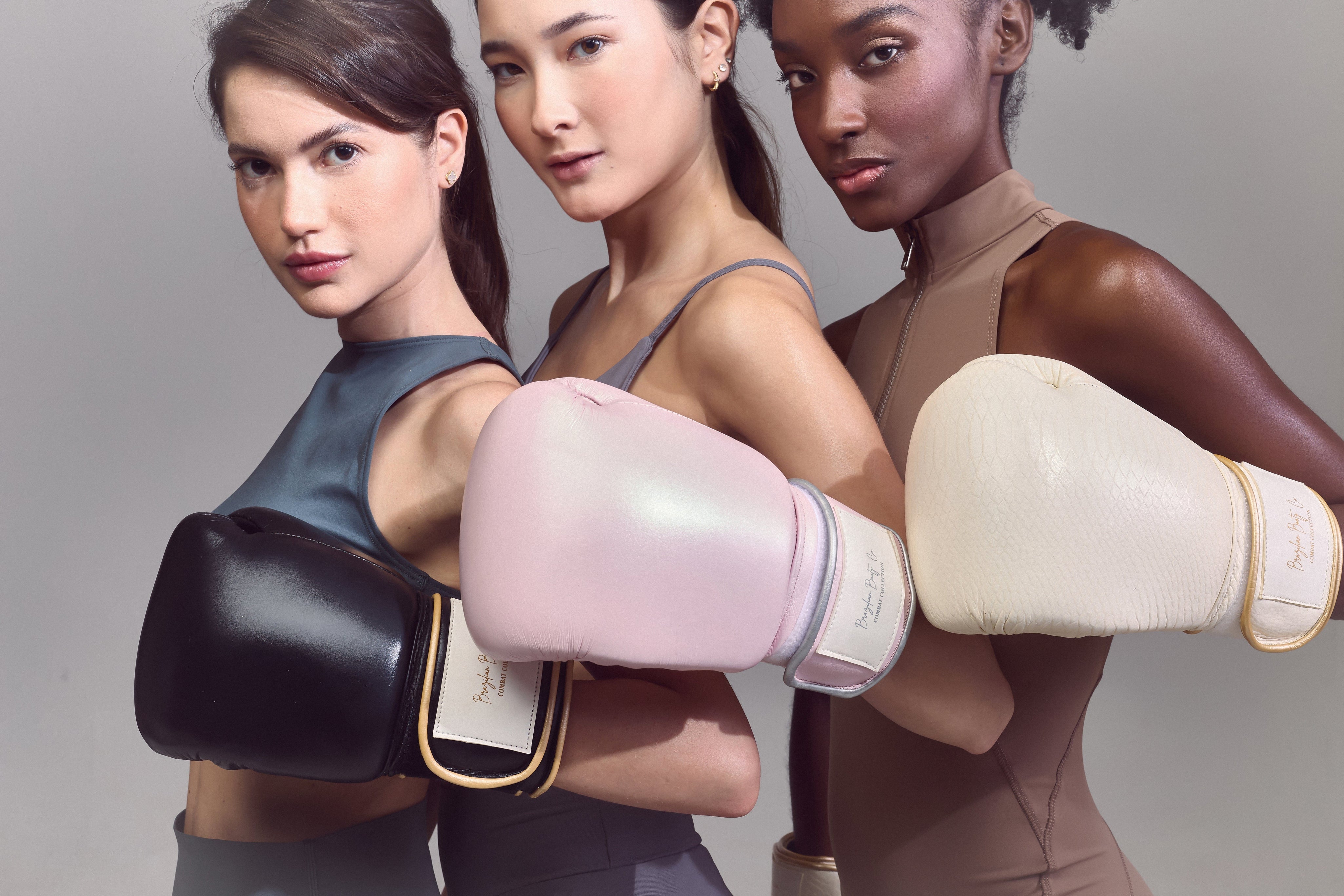 Brazilian Booty Co boxing gloves in black, pink, and ivory